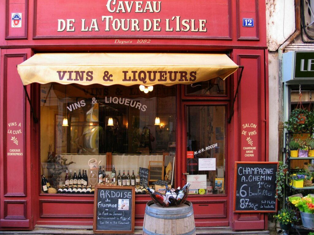 Colorful French shop selling wines and liqueurs with vintage charm.