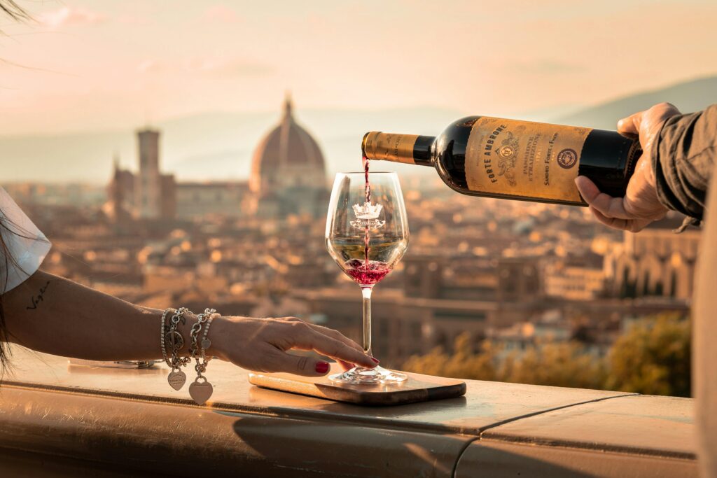 Elegant wine pouring scene with Florence's iconic skyline and cathedral in the backdrop.