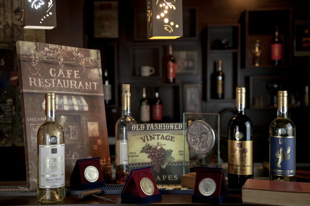 A classy arrangement of wine bottles in a vintage-themed restaurant setting.